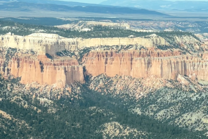 a canyon with a city in the background