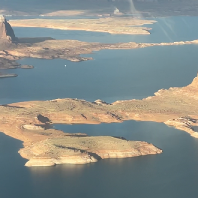 a mountain with water in the background